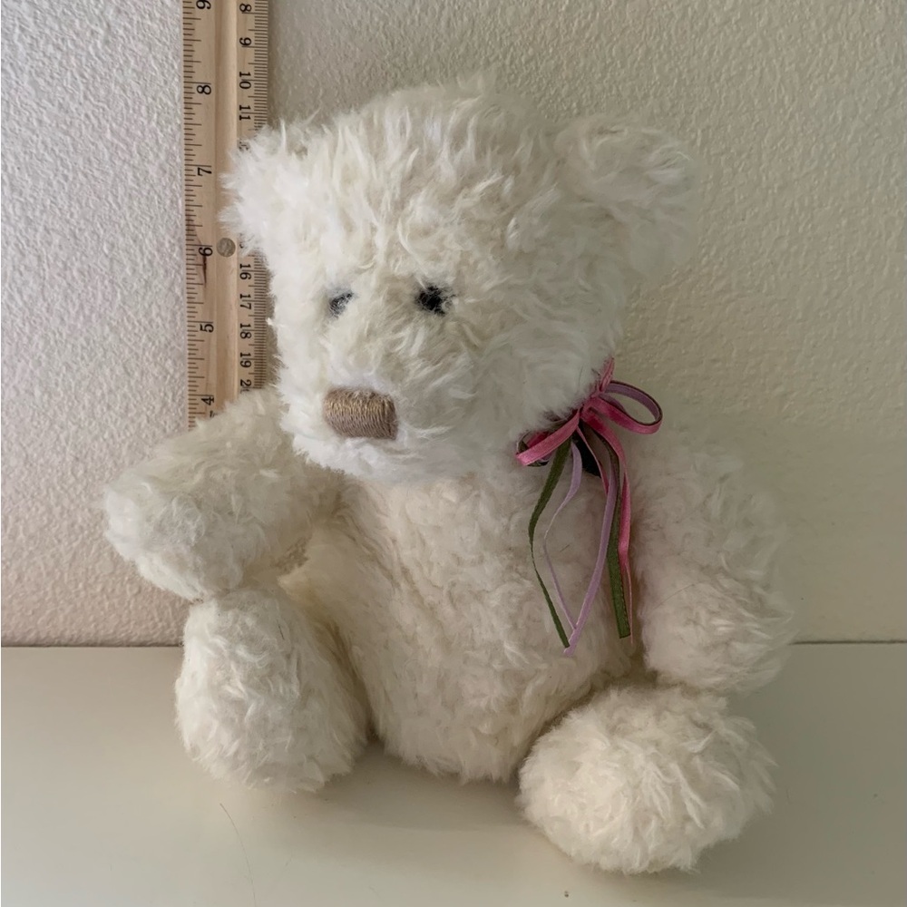 Gund white plush bear with ribbon on neck. Bean bottom bear.